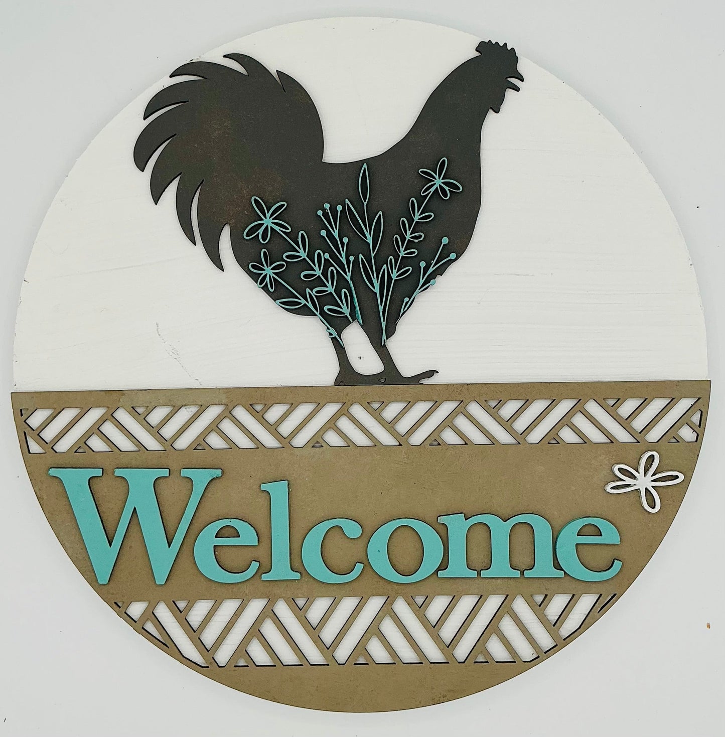 Decorative sign with a rooster silhouette and 'Welcome' text on a white background