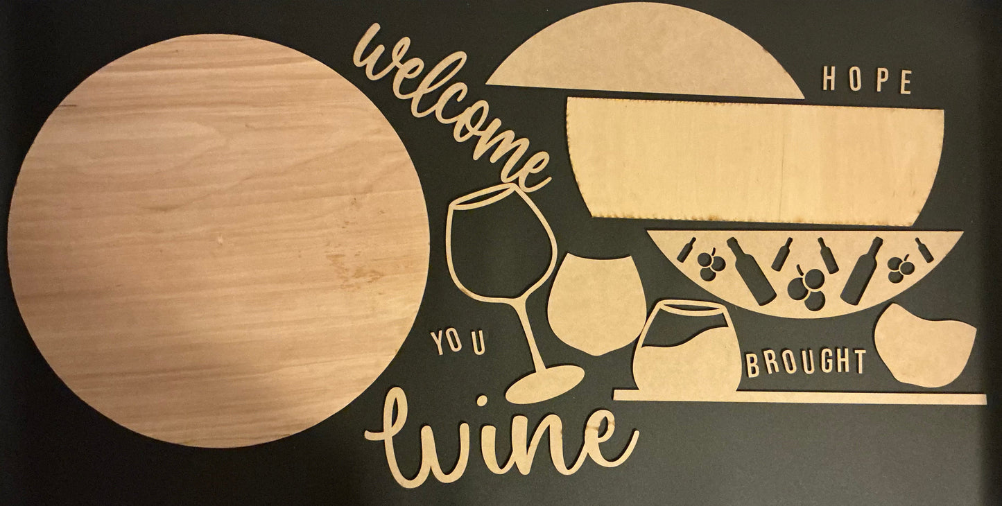 Decorative wine-themed sign with text and graphics on a black background