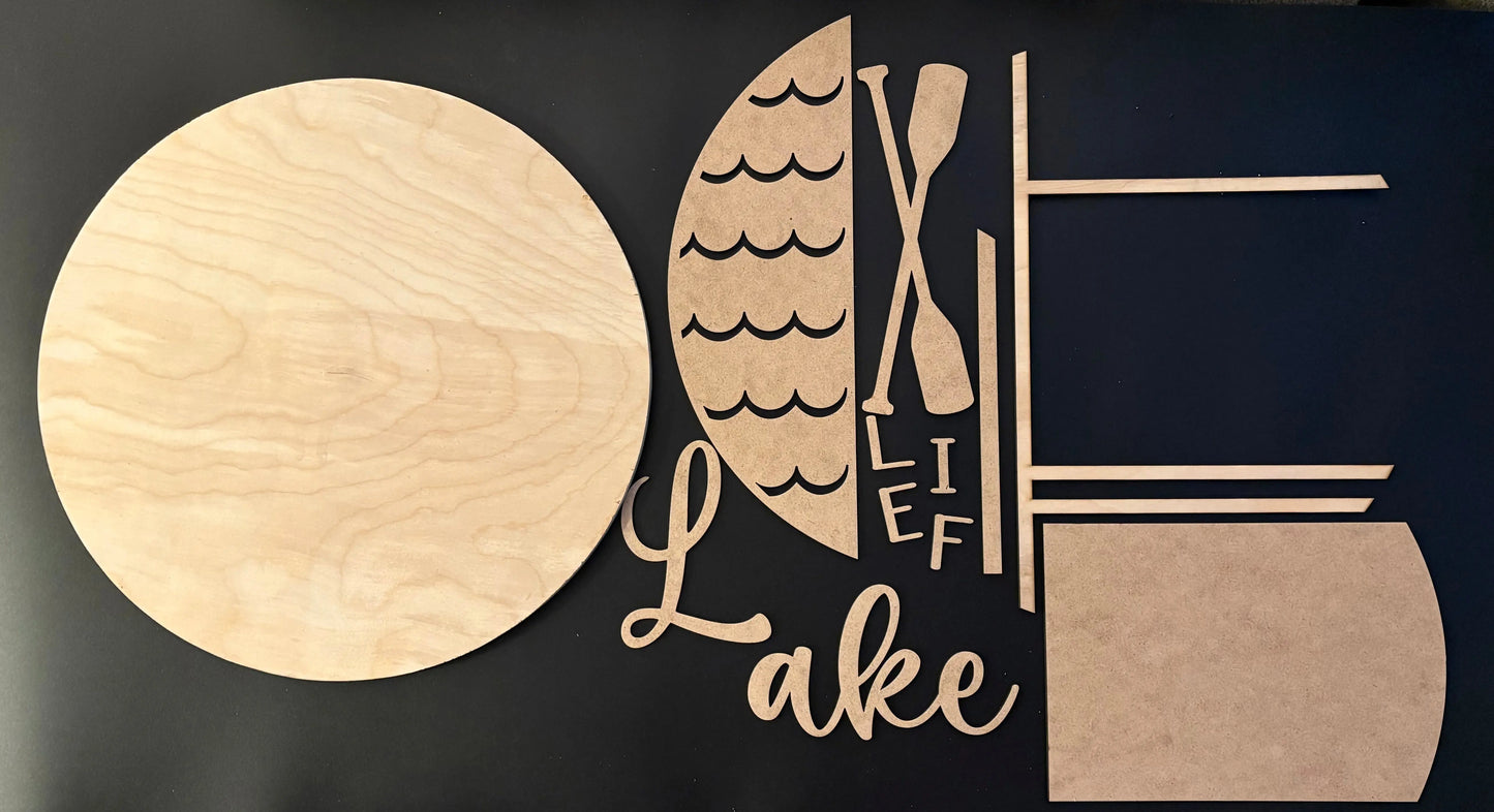 Wooden cutout shapes on a black background with 'Lake Life' text