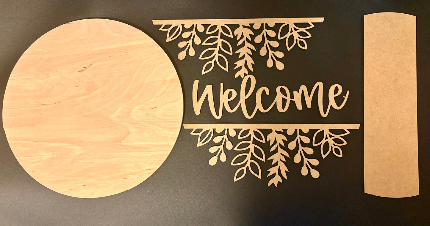 Wooden 'Welcome' sign with leaf designs on a dark background