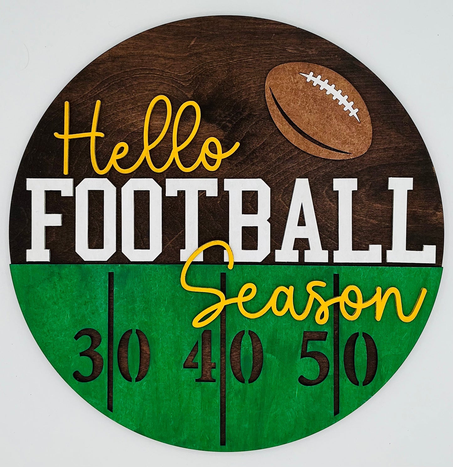 Circular wooden sign with 'Hello Football Season' text and football graphic on a white background