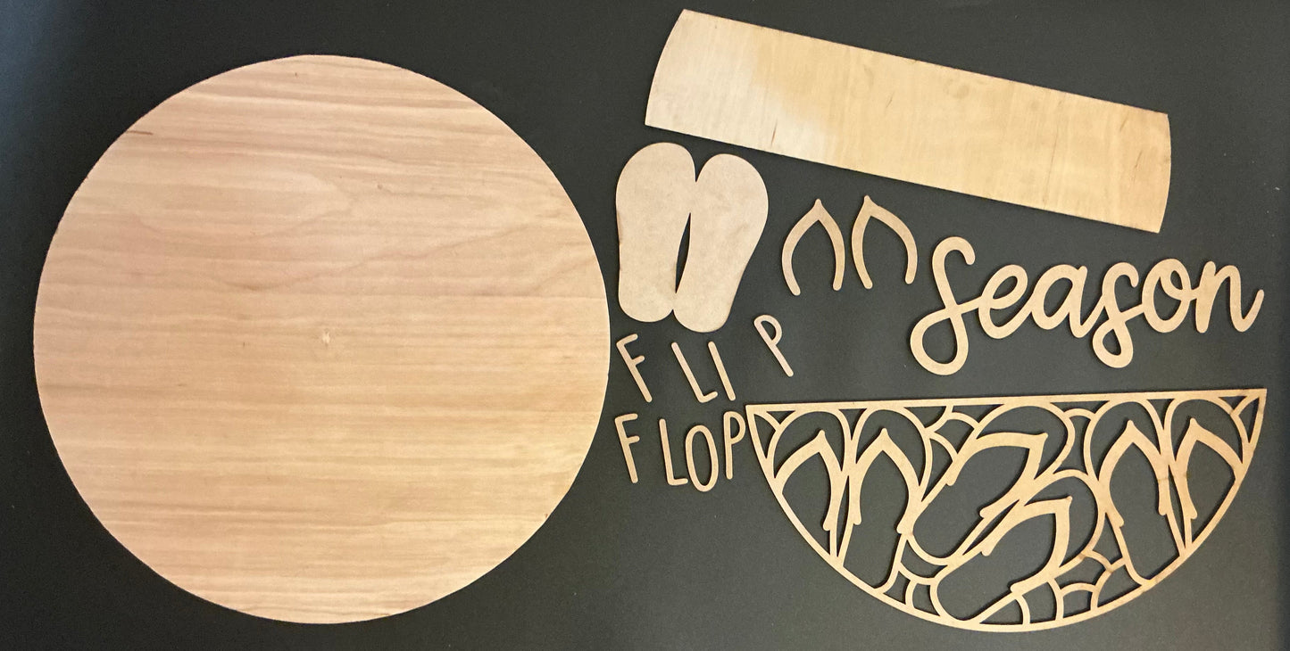 Wooden flip flop and sandal cutouts with 'Flip Flop Season' text on a black background
