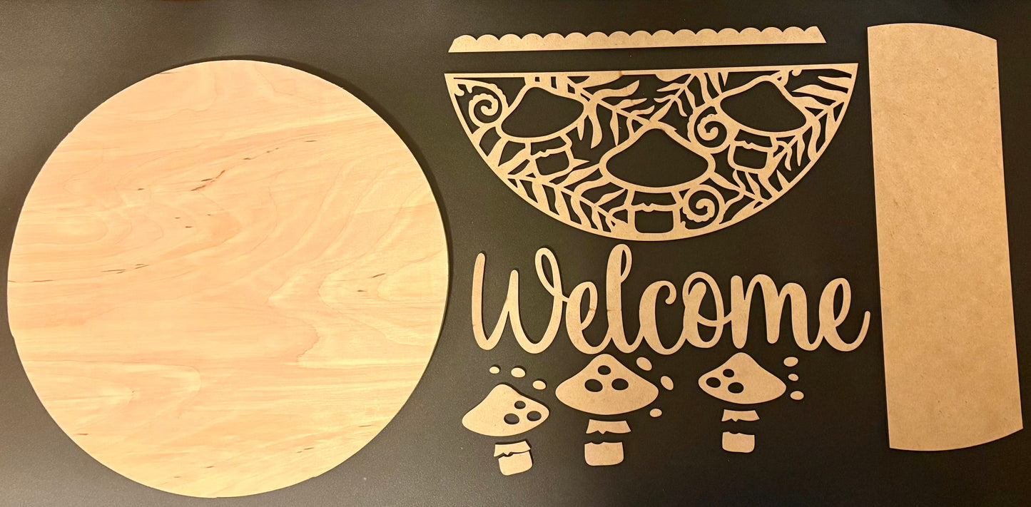 Wooden cutouts of a pizza, mushrooms, and the word 'Welcome' on a black background