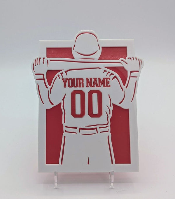 Personalized baseball player cutout with customizable name and number on a red and white background