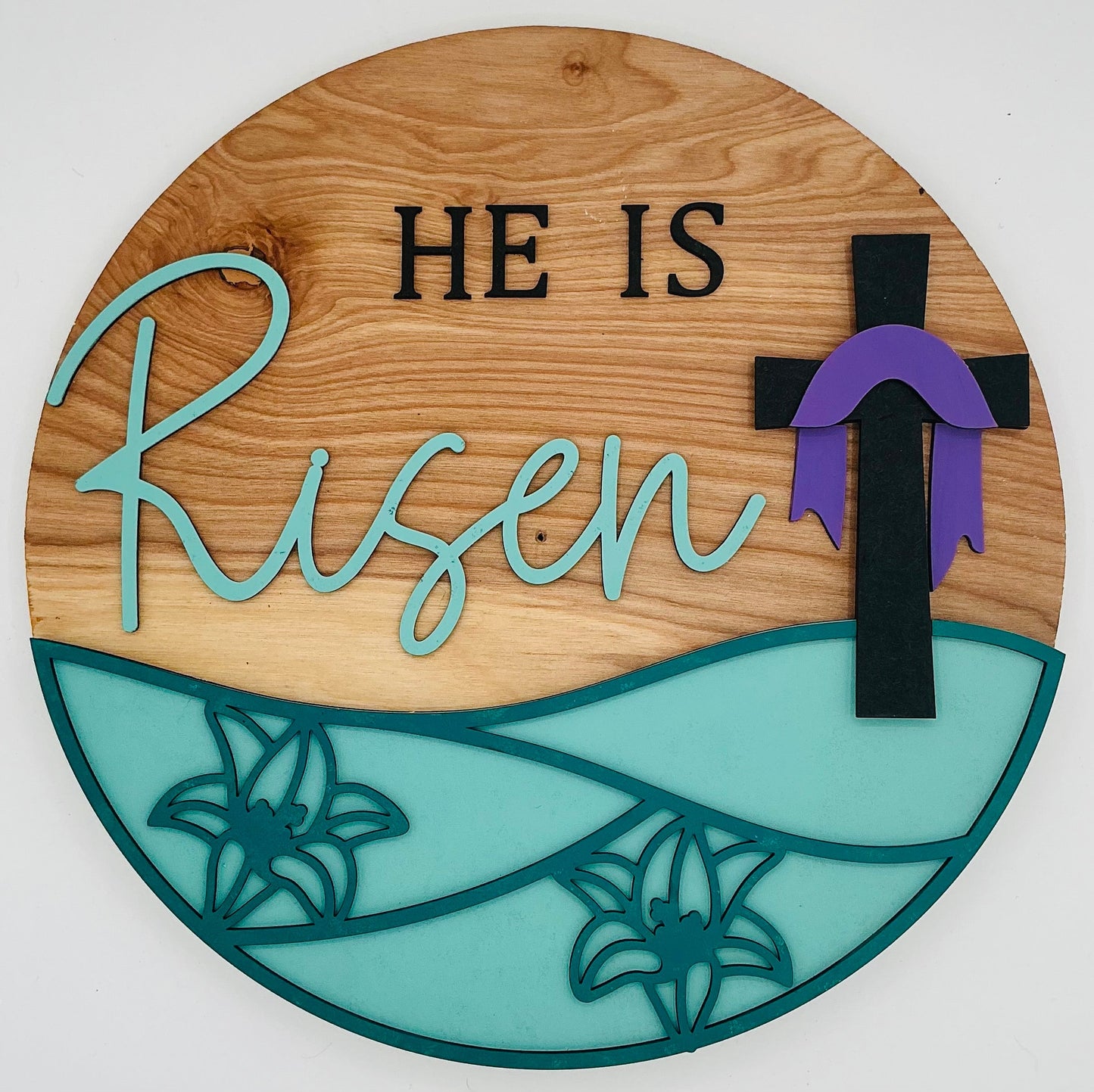 He is Risen wall decor featuring wood and cross design, perfect for Easter or faith-inspired home decoration.
