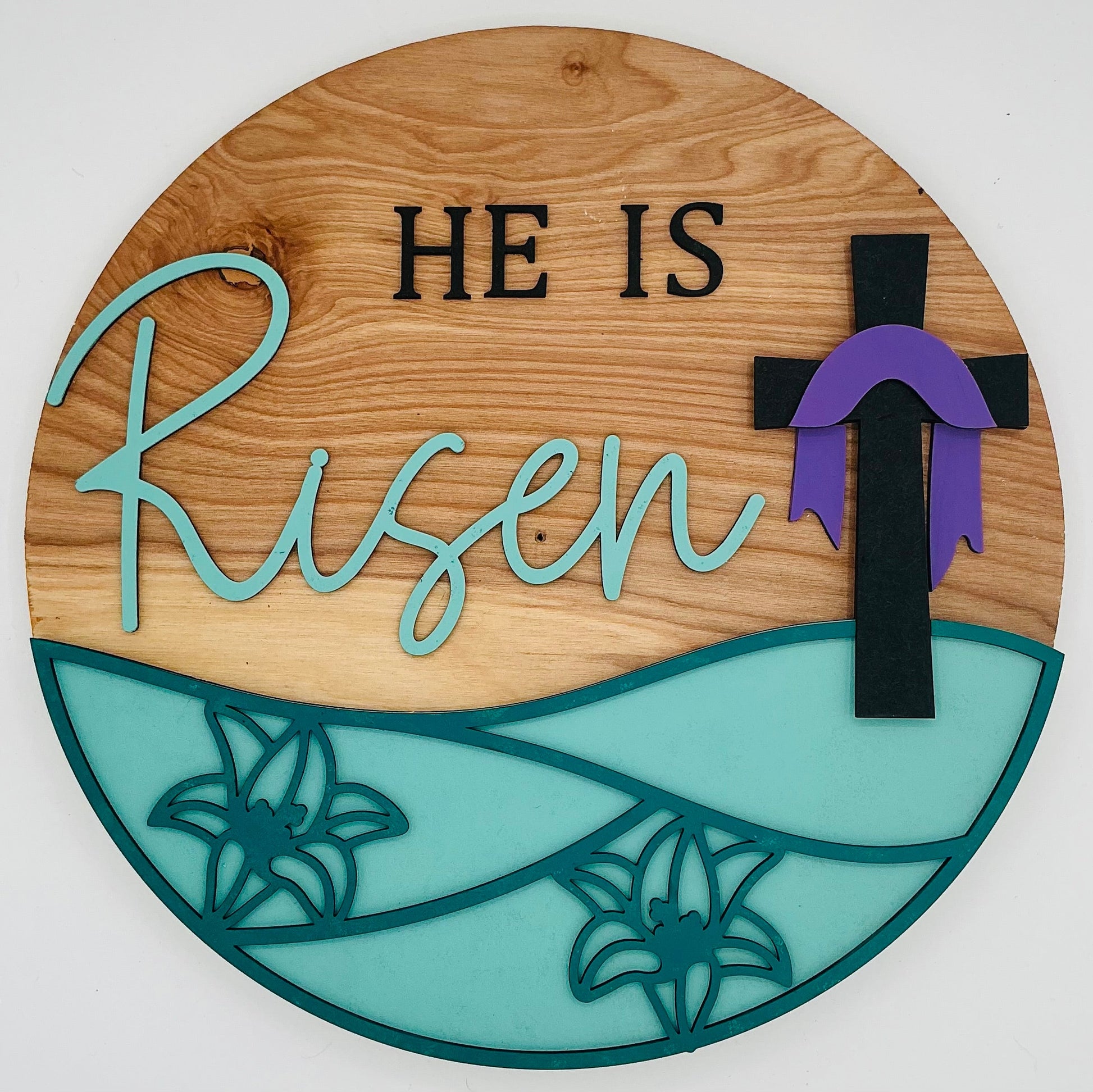 He is Risen wall decor featuring wood and cross design, perfect for Easter or faith-inspired home decoration.