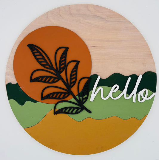 Round wooden sign with leaf design and 'hello' text on a white background