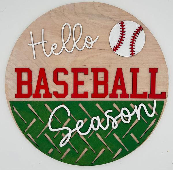 Wooden circular sign with 'Hello Baseball Season' text and a baseball graphic on a white background