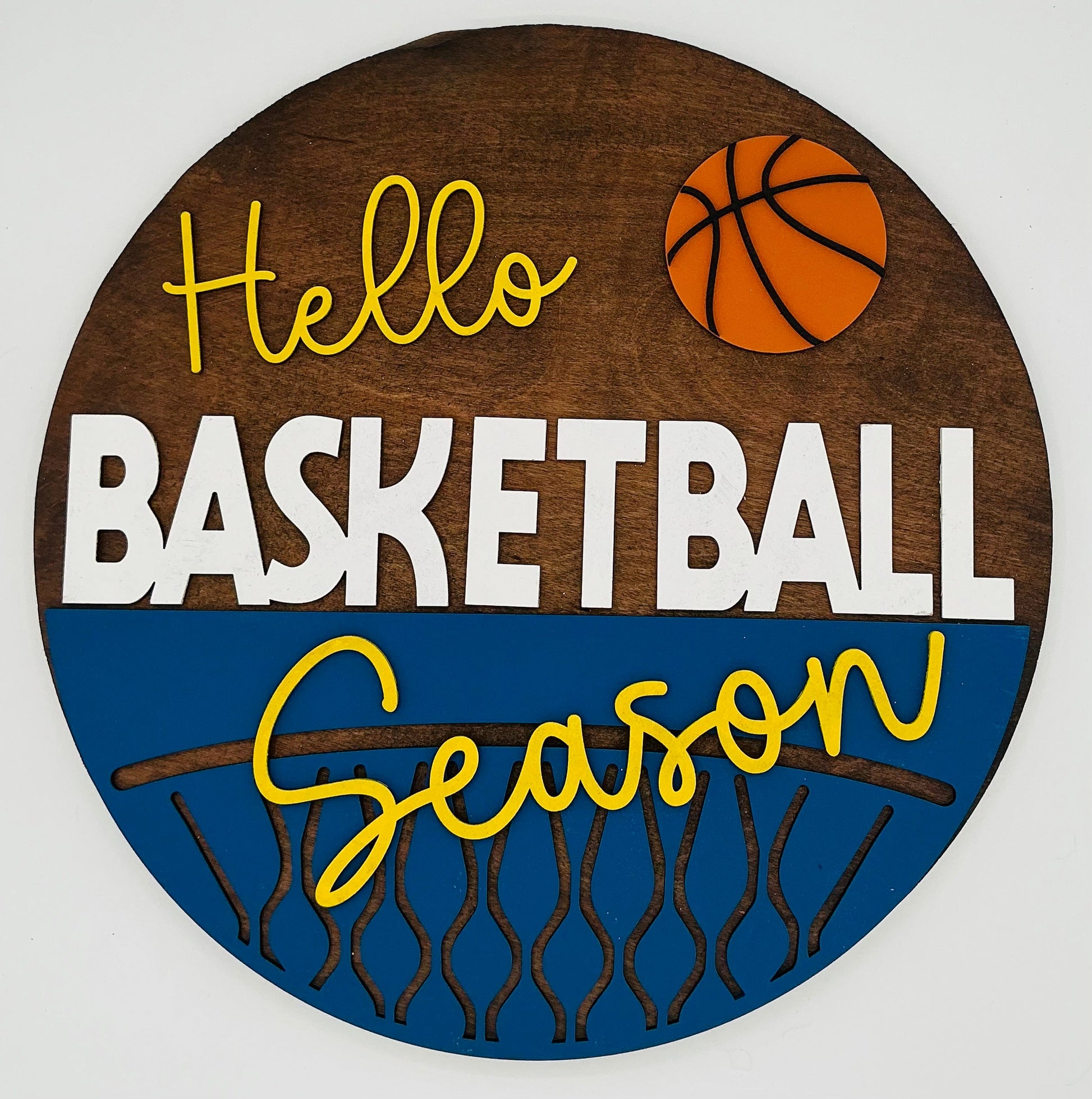 Decorative sign with 'Hello Basketball Season' text and basketball graphics on a wooden background.