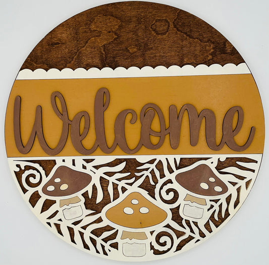 Round wooden sign with 'Welcome' text and mushroom design on a white background
