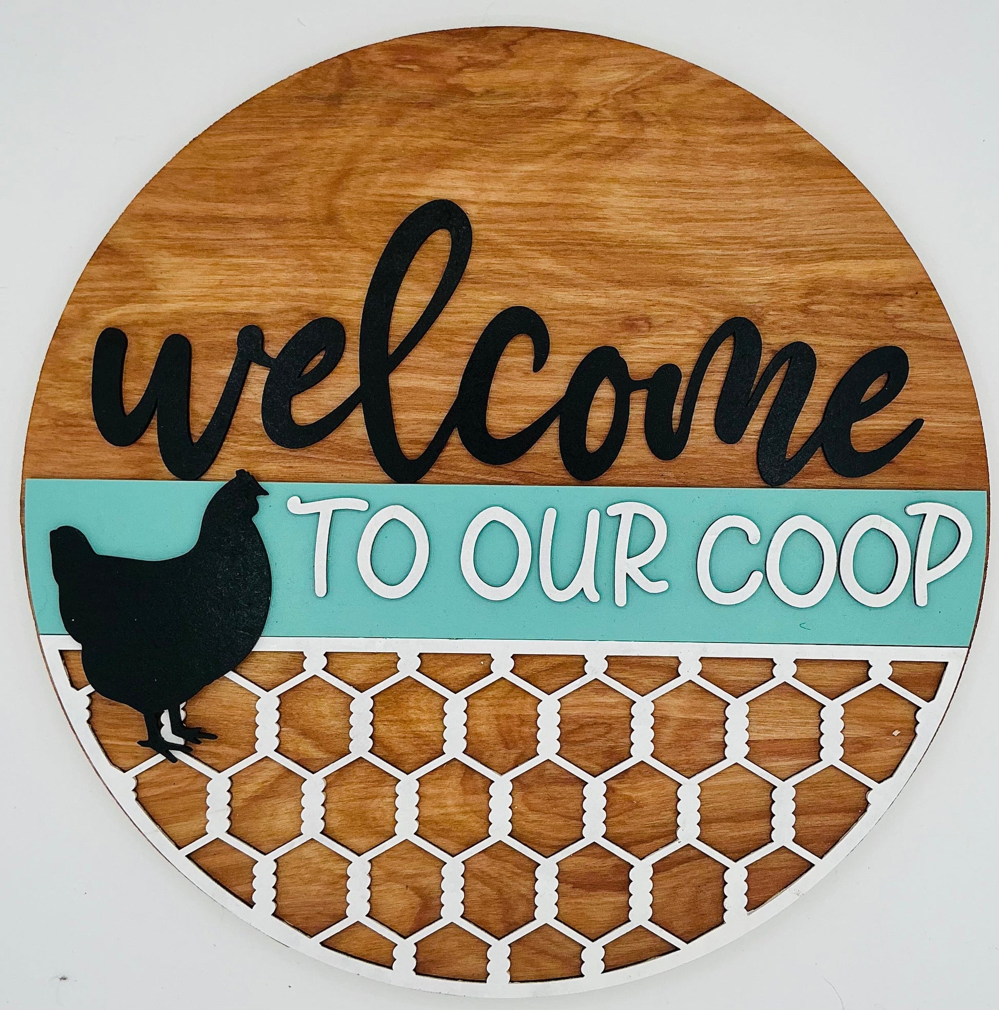 Wooden sign with 'welcome to our coop' text and chicken silhouette on a white background