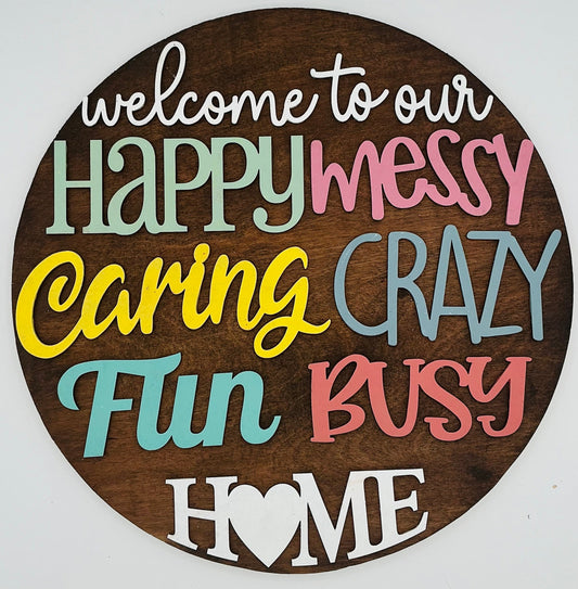 Round wooden sign with colorful text on a white background