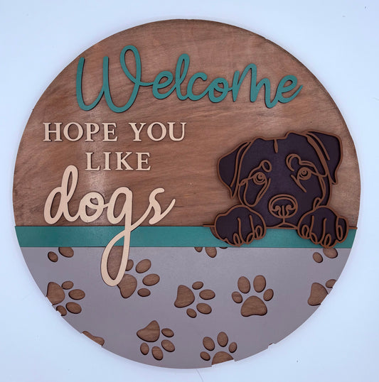 Wooden circular sign with text 'Welcome, Hope You Like Dogs' and a dog illustration on a white background.