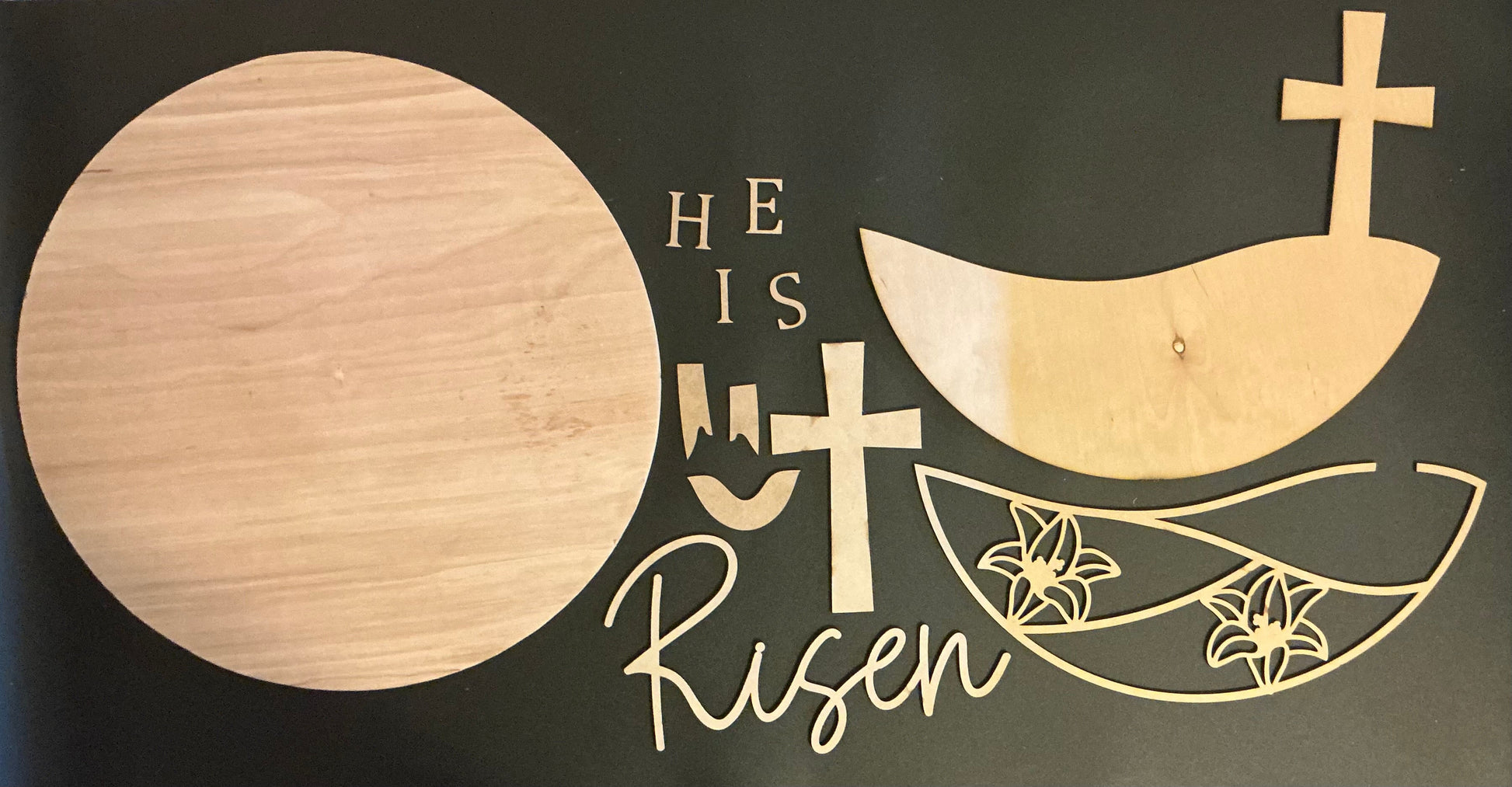 Wooden He is Risen cross design with floral elements, symbolizing faith and resurrection.