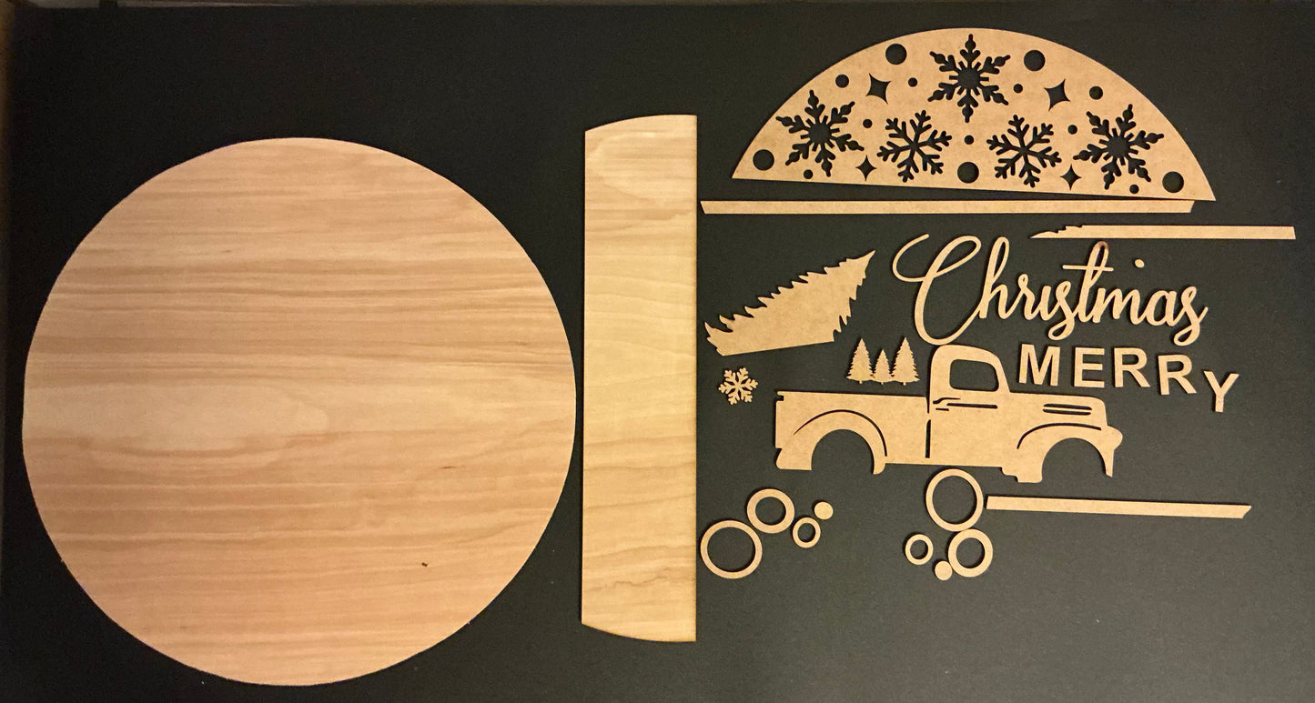 Wooden cutting board with Christmas design featuring a truck and 'Merry Christmas' text on a black background.